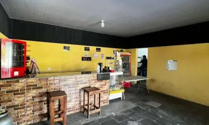 Salão comercial em Terra Preta com casa nos fundos à venda