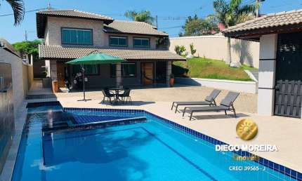 Casa À venda em Terra Preta com 3 dormitórios, suíte com hidromassagem.