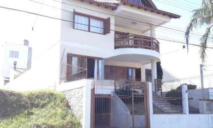 Casa em condomínio fechado com 3 quartos à venda na Rua Antonio Delapieve, 130, Alto Petrópolis, Porto Alegre, 227 m2 por R$ 1.300.000