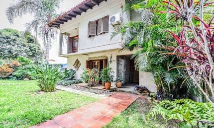 Casa em condomínio fechado com 4 quartos à venda na Acesso das Orquídeas, 93, Santa Tereza, Porto Alegre, 231 m2 por R$ 520.000