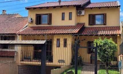 Casa com 3 quartos à venda na Rua Doutor Mário Totta, 2812, Tristeza, Porto Alegre, 287 m2 por R$ 870.000