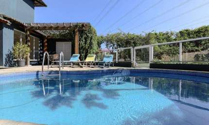 Casa à venda no Condomínio Aruã Eco Park Lagos em Mogi das Cruzes com reserva e pomar ao fundo