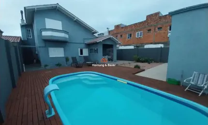 Casa com piscina à venda em Capão da Canoa, no bairro Santo Antônio