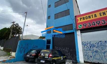 Prédio Comercial de 4 Andares com Salas Amplas e Vagas de Garagem.