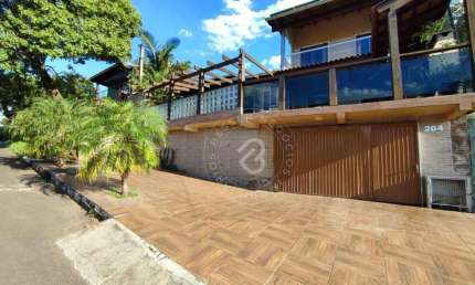 Casa com 4 dormitórios para alugar, 350 m² por R$ 5.070,00/mês - Camboim - Sapucaia do Sul/RS