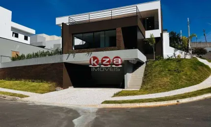 Casa de alto padrão a venda no condomínio tabapuã, valinhos-sp: 3 suítes, 3 salas, 5 banheiros e 4 vagas e amplo gourmet.