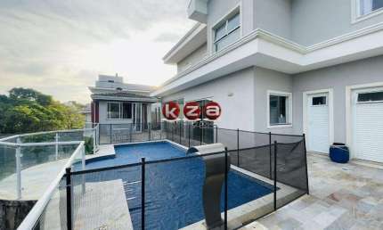 Casa de luxo no Condomínio Terras de Santa Teresa em Vinhedo, com 4 suítes, 3 salas e 350m² de área privativa. Venha conferir!