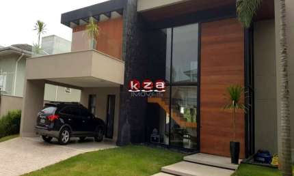 Luxuosa casa de alto padrão no Condomínio Portal do Lago em Valinhos-SP: 3 suítes, 3 salas, 5 banheiros, 4 vagas de garagem, 454m².