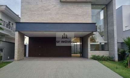 Belíssimo sobrado de 400m², 5 suítes com closet, à venda no Alphaville 1