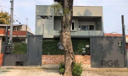 Casa com 4 quartos à venda na Rua Menezes Paredes, 341, Nonoai, Porto Alegre