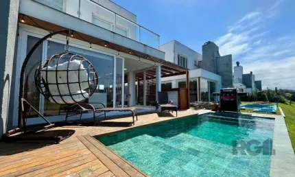 Casa em condomínio fechado com 4 quartos à venda na Avenida Jaçanã, 1185, Atlântida, Xangri-Lá