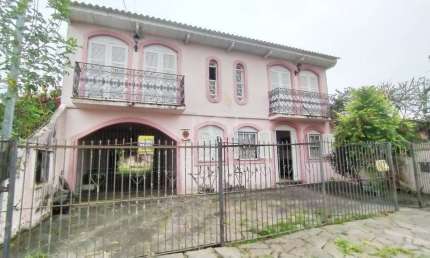 Casa com 3 quartos à venda na Rua Jacipuia, 420, Guarujá, Porto Alegre