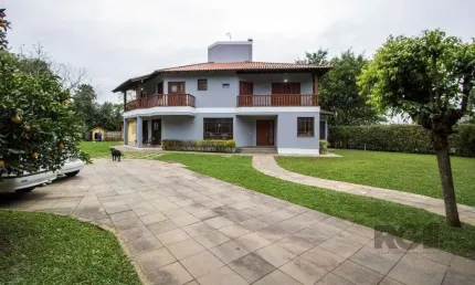 Sobrado com 6 suites, lareira, lavabo, pátio - Bairro Belém Velho