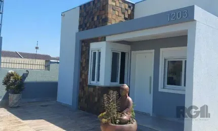 Casa com 2 dormitórios, sendo 1 suíte no bairro Florida em Guaíba