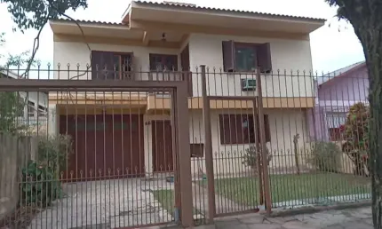 Casa com 3 quartos à venda na Avenida Cruz Alta, 499, Nonoai, Porto Alegre