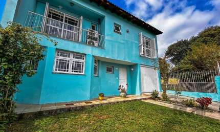 Casa com 4 quartos à venda na Rua Jerolomo Minuzo, 224, Vila Nova, Porto Alegre