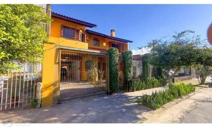 Casa com 4 quartos à venda na Rua Coronel Jaime da Costa Pereira, 420, Partenon, Porto Alegre