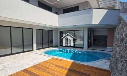 Casa em condomínio de alto padrão à venda, com 3 dormitórios sendo 3 suítes, área gourmet com piscina e cozinha, 6 vagas de garagem!