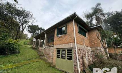 Casa com 3 quartos à venda na Rua dos Canudos, 358, Cascata, Porto Alegre