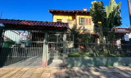 Casa com 3 quartos à venda na Rua Frederico Etzberger, 278, Nonoai, Porto Alegre