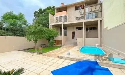 Casa com 3 quartos à venda na Rua Alcebíades Antônio dos Santos, 379, Nonoai, Porto Alegre