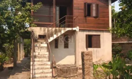 Casa com 4 quartos à venda na Rua Marquês do Maricá, 134, Vila Nova, Porto Alegre