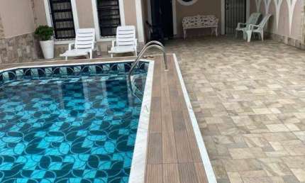 Casa com 3 dormitórios à venda, 159 m² por R$ 850.000,00 - Caiçara - Praia Grande/SP
