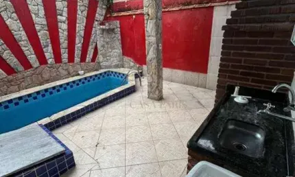 Casa com 3 dormitórios à venda, 165 m² por R$ 615.000,00 - Caiçara - Praia Grande/SP