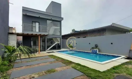 Casa com 3 dormitórios à venda, 140 m² por R$ 1.050.000 - Massaguaçu - Caraguatatuba/SP