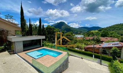 CASA Á VENDA NA GRANJA COMARY 5 SUÍTES - ÁREA GOURMET, ESPAÇO FITNESS, VISTA PARA CBF E OS LAGOS.