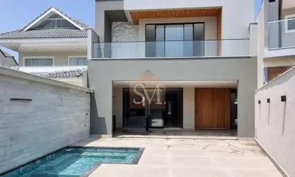 Recreio-Casa contemporânea triplex à venda 5 quartos sendo 4 suítes 498m², 3 vagas, piscina-Condomínio Riviera del Sol