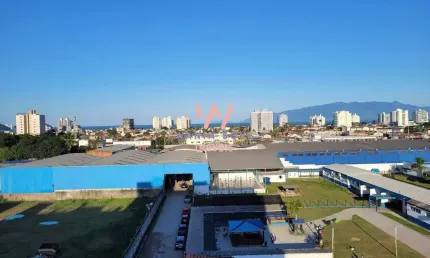 Apartamento vista mar, com 2 dormitórios à venda, 56 m² por R$ 410.000 - Indaiá - Caraguatatuba/SP