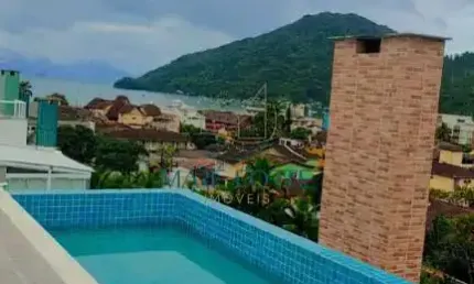 Prédio novo com varanda gourmet e piscina com borda infinita com vista para o mar