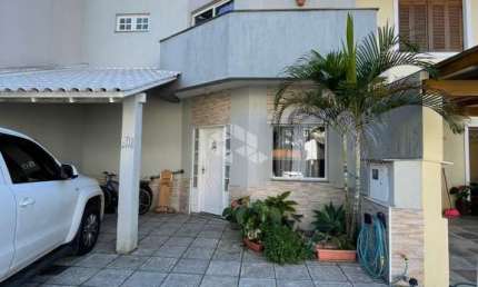 Casa em condomínio fechado com 3 quartos à venda na Rua Deputado Hugo Mardini, 1780, Passo das Pedras, Porto Alegre, 140 m2 por R$ 680.000