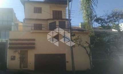 Casa com 3 quartos à venda na Rua Doutor Barbosa Gonçalves, 61, Chácara das Pedras, Porto Alegre, 296 m2 por R$ 1.060.000