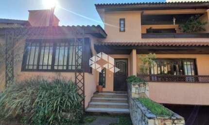 Casa em condomínio fechado com 3 quartos à venda na Rua Tocantins, 869, Agronomia, Porto Alegre, 284 m2 por R$ 1.560.000