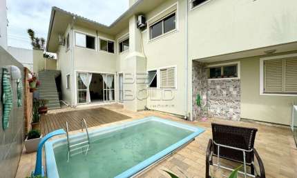 Casa em condomínio fechado com 5 quartos à venda na Travessa América, 68, Coqueiros, Florianópolis por R$ 2.500.000