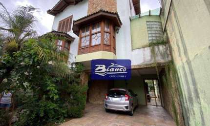 Casa comercial com 4 salas para alugar na Rua Antônio José Romão Filho, 221, Jardim Maia, Guarulhos