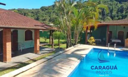 Casa de 4 dormitórios, mais um reversível, com 300m² e 720m² de terreno no Residencial VerdeMar, Massaguaçu, Caraguatatuba - SP