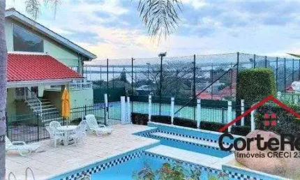 Casa em condomínio fechado com 3 quartos à venda na Rua Padre João Batista Reus, 983, Vila Conceição, Porto Alegre por R$ 950.000