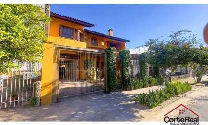 Casa com 4 quartos à venda na Rua Coronel Jaime da Costa Pereira, 340, Partenon, Porto Alegre por R$ 1.090.000