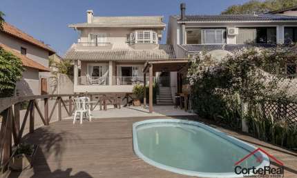 Casa com 3 quartos à venda na Rua Charruas, 267, Espírito Santo, Porto Alegre por R$ 1.267.000