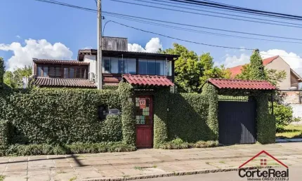 Casa com 3 quartos à venda na Avenida Guarujá, 140, Guarujá, Porto Alegre por R$ 749.000