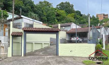 Casa com 3 quartos à venda na Avenida Vicente Monteggia, 2406, Vila Nova, Porto Alegre por R$ 495.000