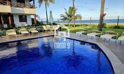 Apartamento mobiliado a venda com 2 suítes pé na areia em itacimirim bahia