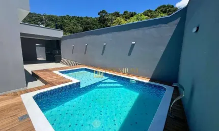 Casa com 3 dormitórios à venda, 131 m² por R$ 900.000 - Massaguaçu - Caraguatatuba/SP