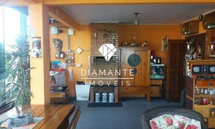Casa com 4 quartos à venda na Rua Elvira Dendena, Hípica, Porto Alegre por R$ 690.000