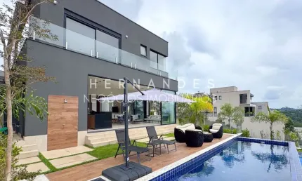 Casa de alto padrão em alphaville - santana de parnaíba-sp: 4 suítes, área gourmet, piscina e energia solar!