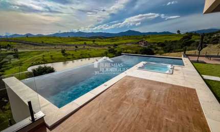 Casa com 3 suítes, 611 m² - Condomínio Village da Serra - Tremembé/SP