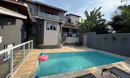 Casa com 5 dormitórios para alugar, 520 m² por R$ 5.500,00/mês - Massaguaçu - Caraguatatuba/SP